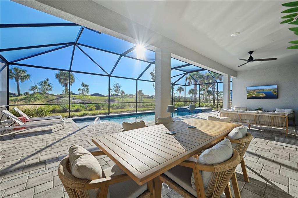 15764 Appalachian Drive Babcock Ranch, FL 33982 - Photo 14 of 46 a dining room with furniture and a floor to ceiling window