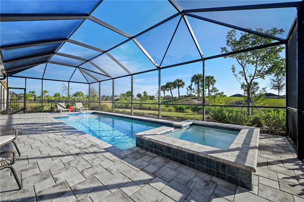 15764 Appalachian Drive Babcock Ranch, FL 33982 - Photo 18 of 46 a view of a swimming pool with a patio
