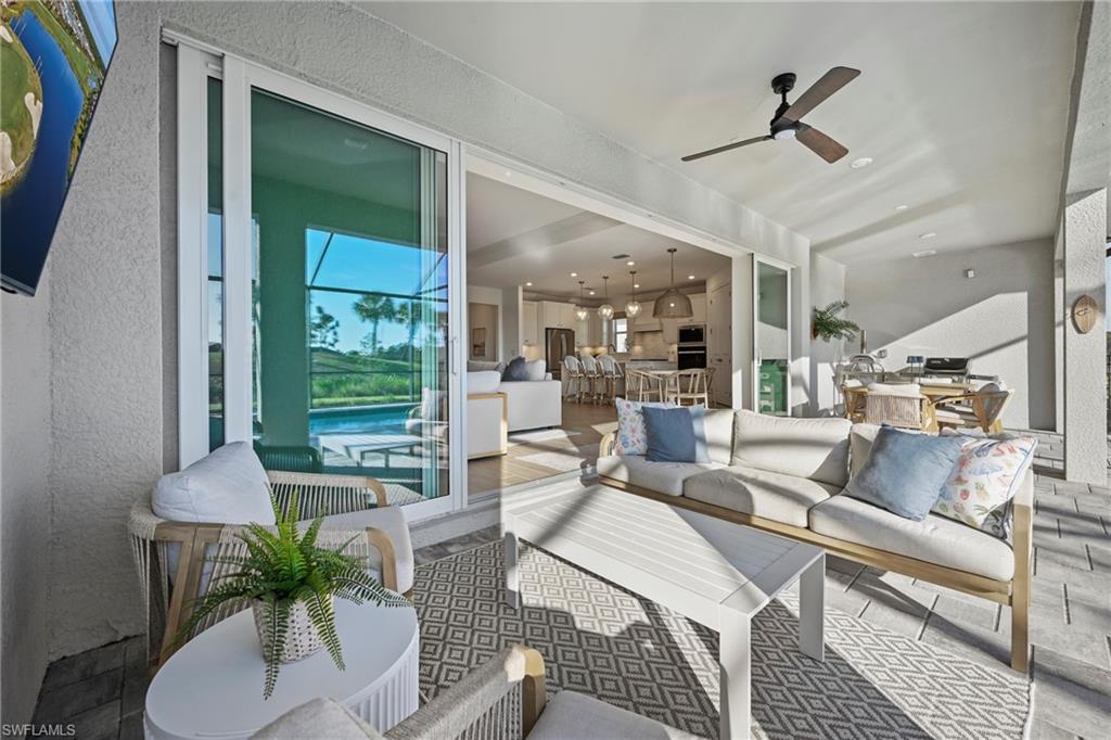 15764 Appalachian Drive Babcock Ranch, FL 33982 - Photo 19 of 46 a living room with furniture and a large window