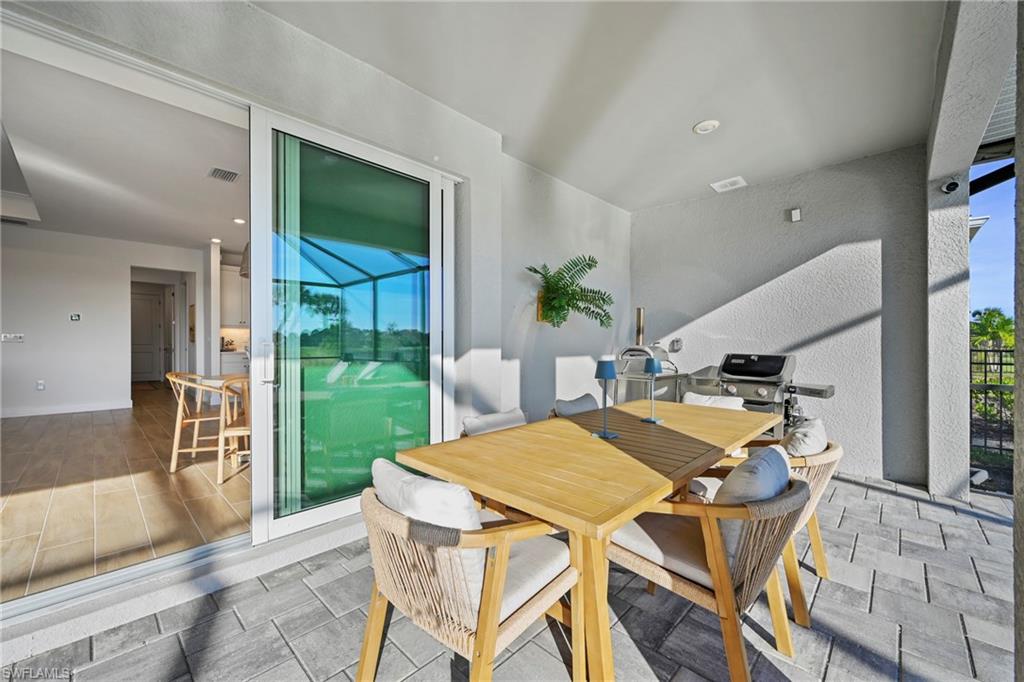 15764 Appalachian Drive Babcock Ranch, FL 33982 - Photo 21 of 46 a view of an outdoor dining space with a table and chairs