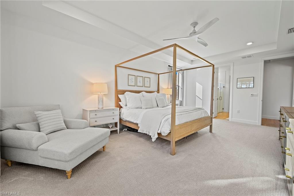 15764 Appalachian Drive Babcock Ranch, FL 33982 - Photo 23 of 46 a spacious bedroom with a bed and a couch