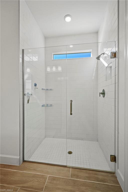 15764 Appalachian Drive Babcock Ranch, FL 33982 - Photo 26 of 46 a bathroom with a shower