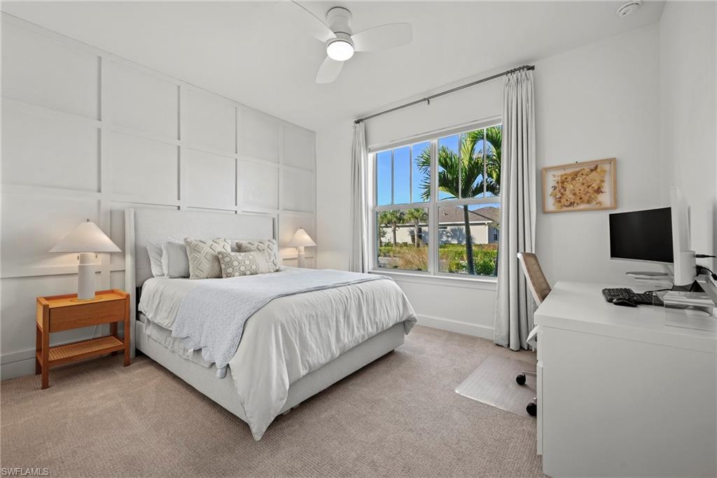 15764 Appalachian Drive Babcock Ranch, FL 33982 - Photo 27 of 46 a bedroom with a bed and a flat tv screen on the dresser