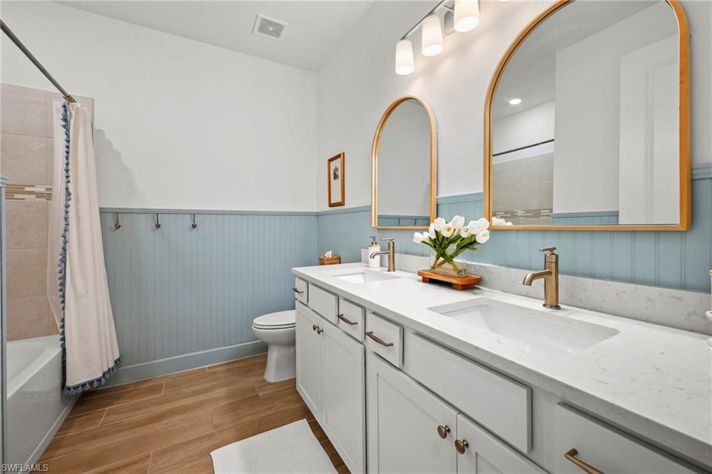 15764 Appalachian Drive Babcock Ranch, FL 33982 - Photo 29 of 46 a bathroom with a sink and a mirror