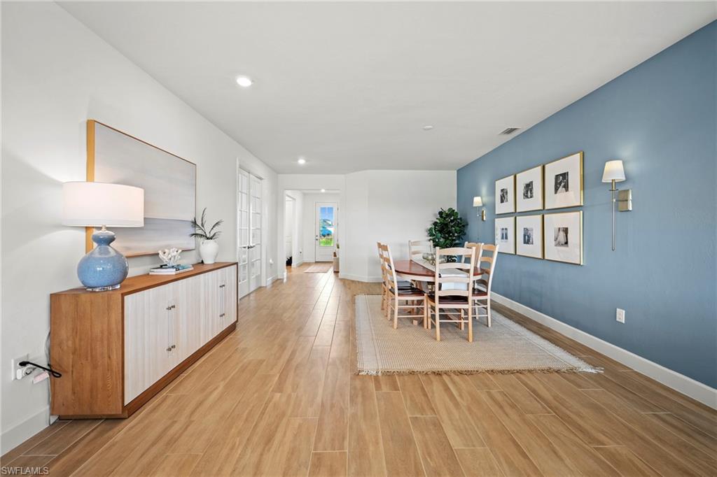 15764 Appalachian Drive Babcock Ranch, FL 33982 - Photo 35 of 46 a large kitchen with a table and chairs