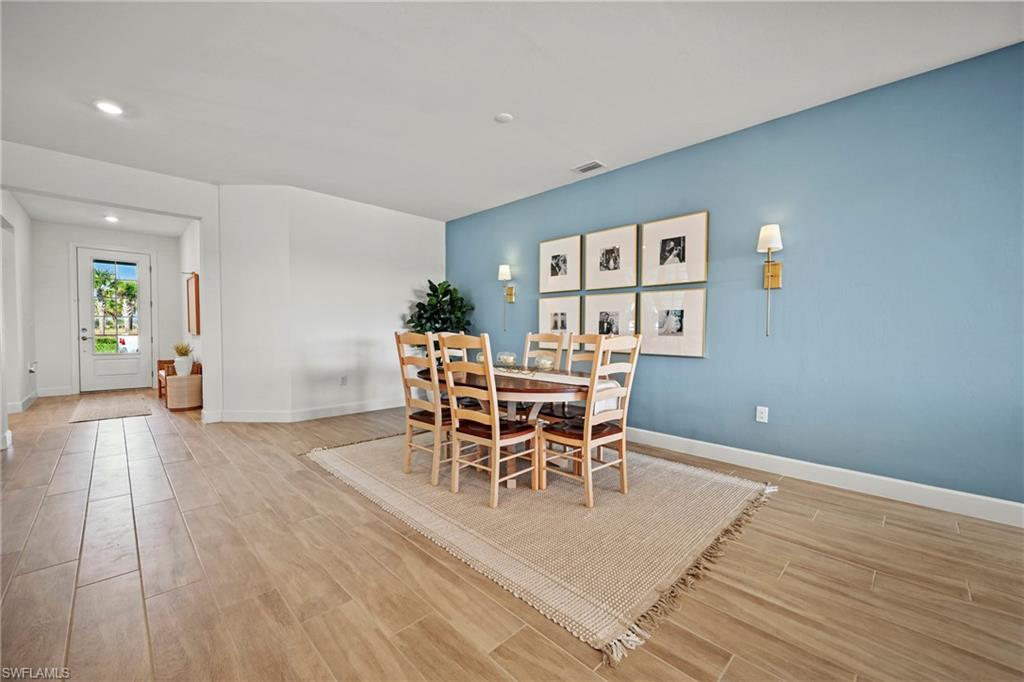 15764 Appalachian Drive Babcock Ranch, FL 33982 - Photo 36 of 46 a view of a dining room with furniture and wooden floor
