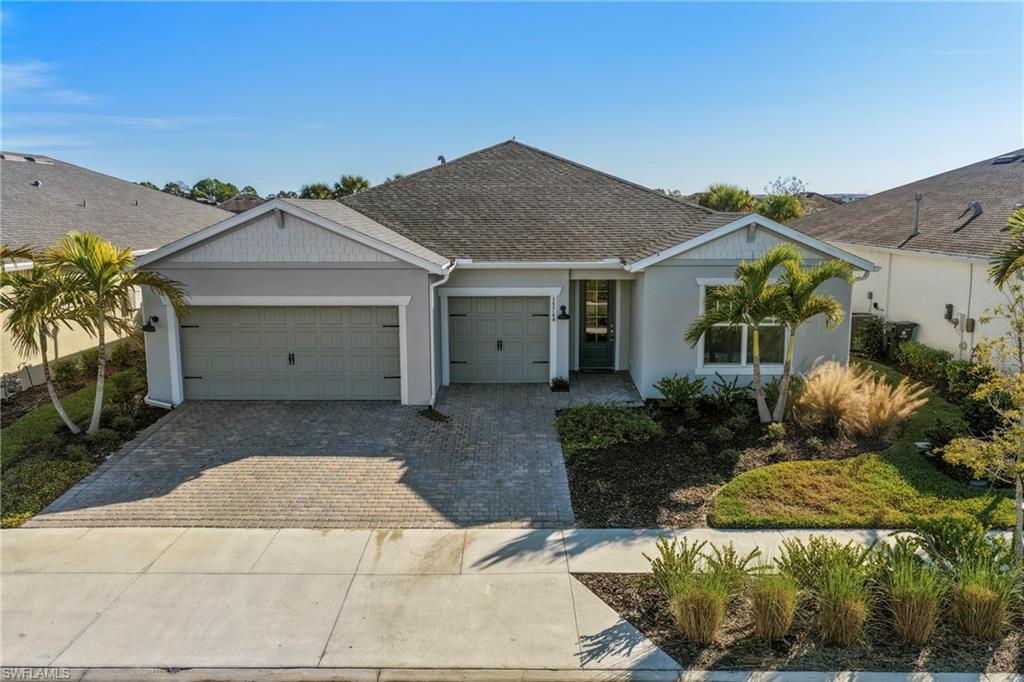 15764 Appalachian Drive Babcock Ranch, FL 33982 - Photo 38 of 46 a view of a house with a yard and plants