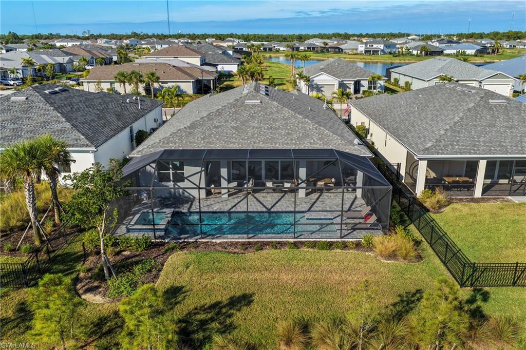 15764 Appalachian Drive Babcock Ranch, FL 33982 - Photo 40 of 46 an aerial view of a house with swimming pool and large trees