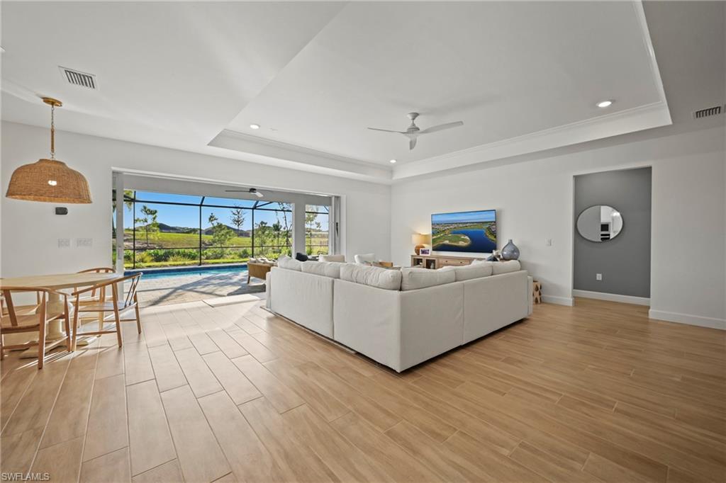 15764 Appalachian Drive Babcock Ranch, FL 33982 - Photo 7 of 46 a living room with furniture and a wooden floor