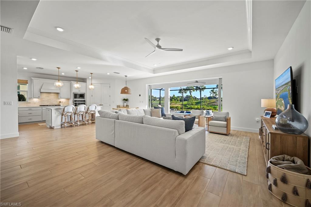 15764 Appalachian Drive Babcock Ranch, FL 33982 - Photo 8 of 46 a living room with furniture and a flat screen tv