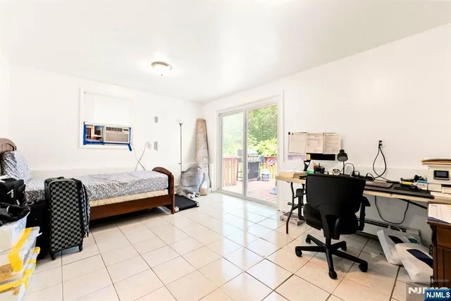 a bathroom with a tub a sink and a shower