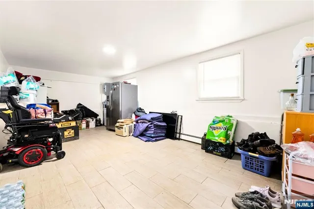 a bed sitting in a bedroom next to a bathroom