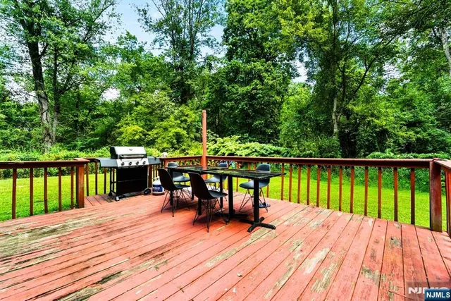 a view of sitting area with furniture and wooden floor