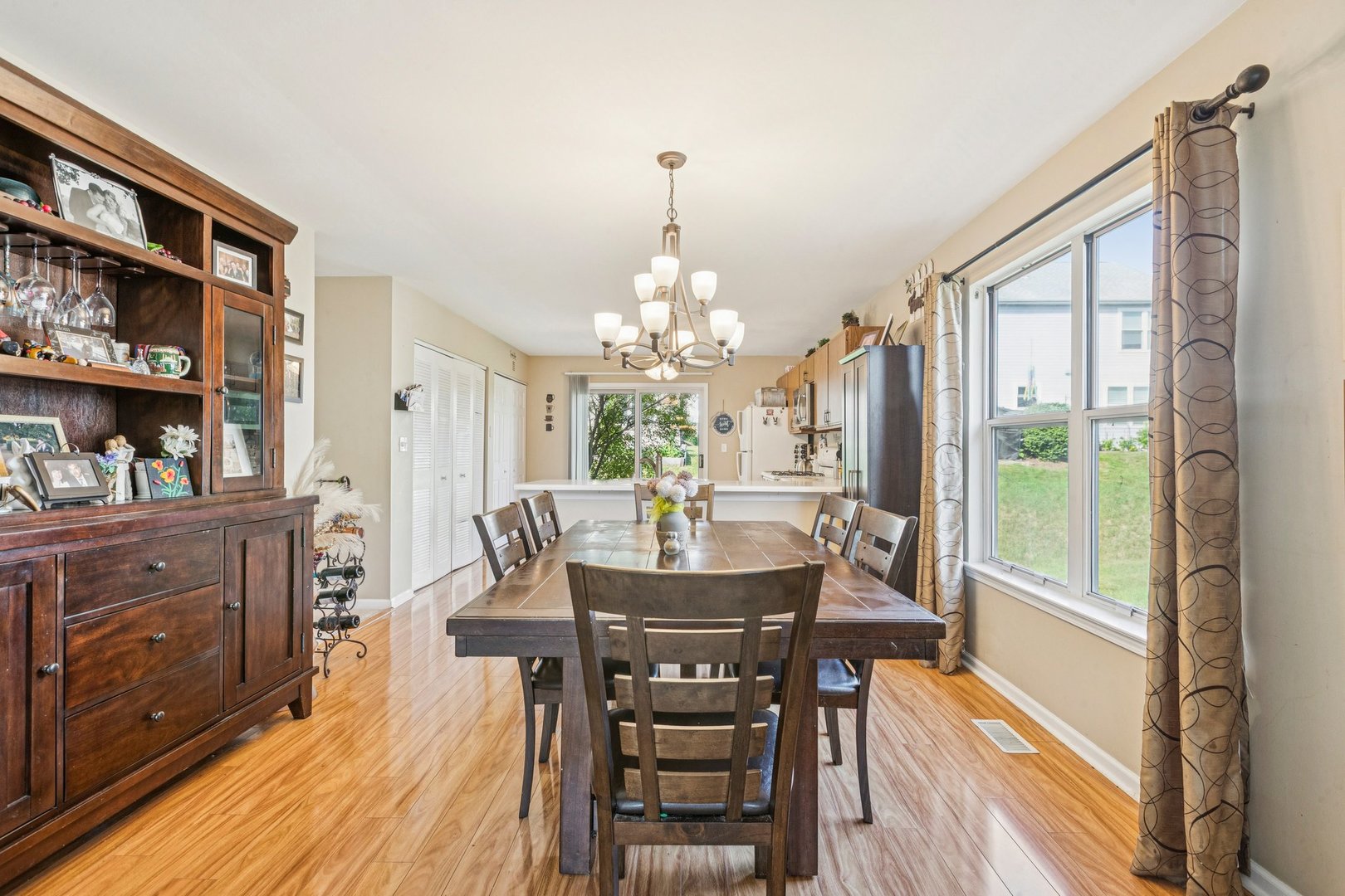 1192 Sumac Trail Hoffman Estates, IL 60192 - Photo 11 of 39 a view of a dining room with furniture window and wooden floor