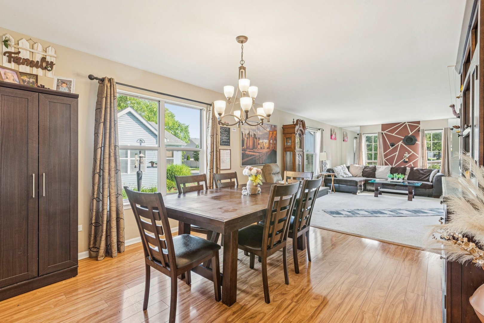 1192 Sumac Trail Hoffman Estates, IL 60192 - Photo 12 of 39 a view of a dining room with furniture window and wooden floor