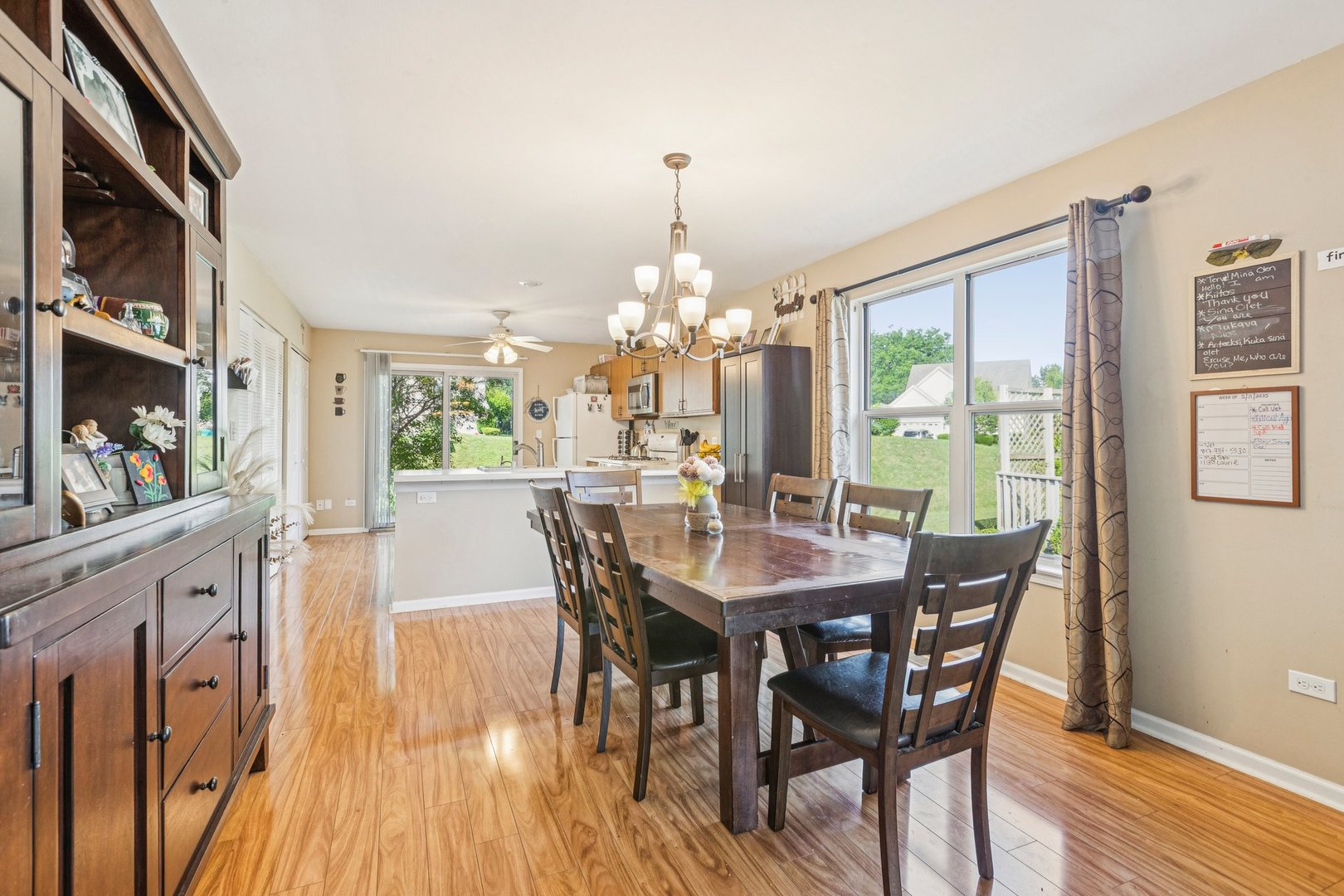 1192 Sumac Trail Hoffman Estates, IL 60192 - Photo 13 of 39 a view of a dining room with furniture window and wooden floor