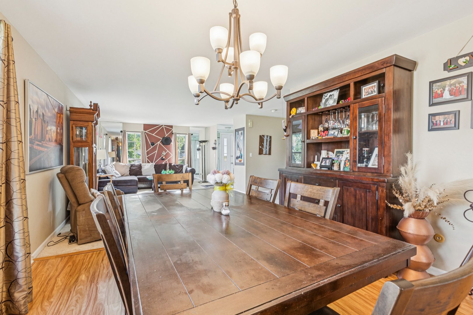 1192 Sumac Trail Hoffman Estates, IL 60192 - Photo 14 of 39 a view of a dining room with furniture and a chandelier