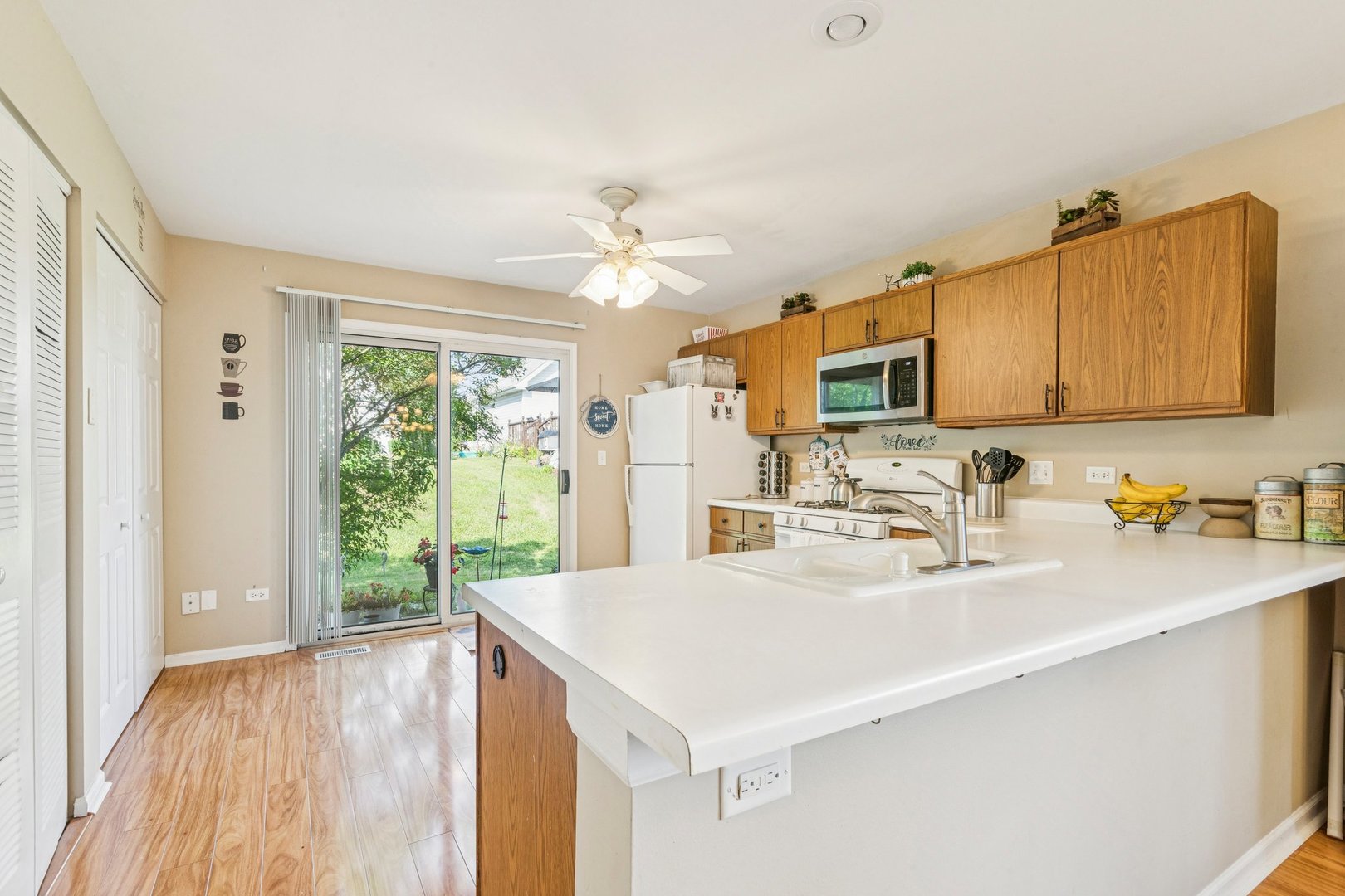 1192 Sumac Trail Hoffman Estates, IL 60192 - Photo 16 of 39 a kitchen with a sink a window and appliances