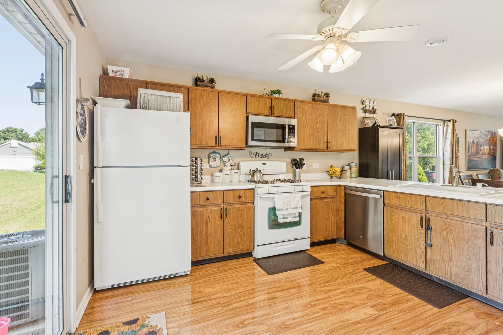1192 Sumac Trail Hoffman Estates, IL 60192 - Photo 18 of 39 a kitchen with cabinets stainless steel appliances and a window