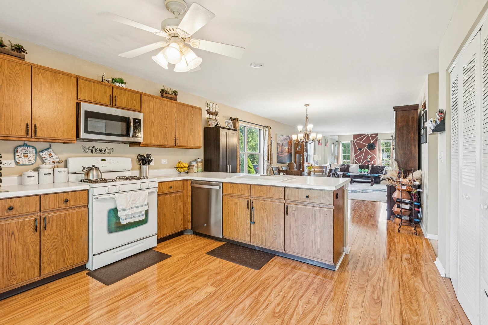 1192 Sumac Trail Hoffman Estates, IL 60192 - Photo 19 of 39 a kitchen with a refrigerator stove top oven and sink