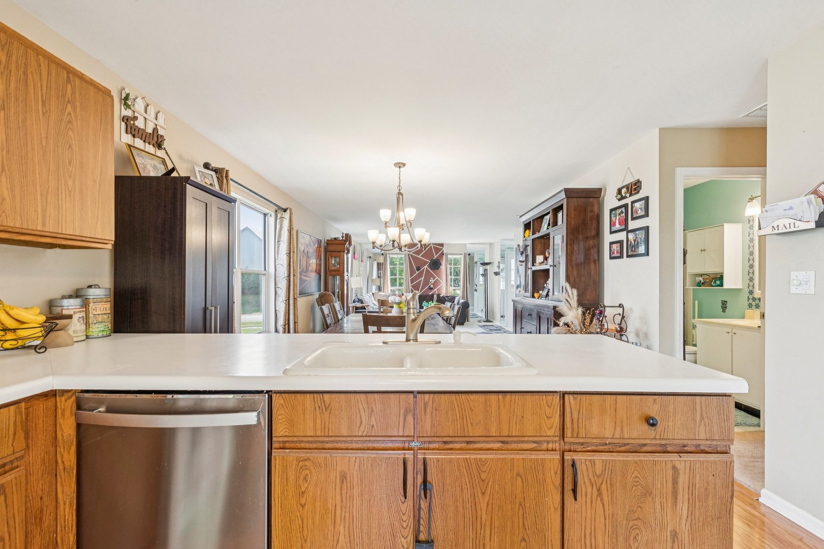 1192 Sumac Trail Hoffman Estates, IL 60192 - Photo 22 of 39 a view of a kitchen with kitchen island granite countertop a refrigerator and a sink