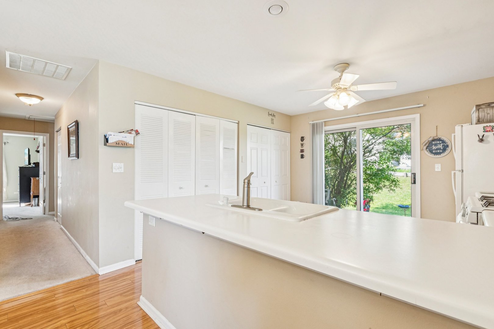 1192 Sumac Trail Hoffman Estates, IL 60192 - Photo 24 of 39 a view of kitchen with furniture and large window