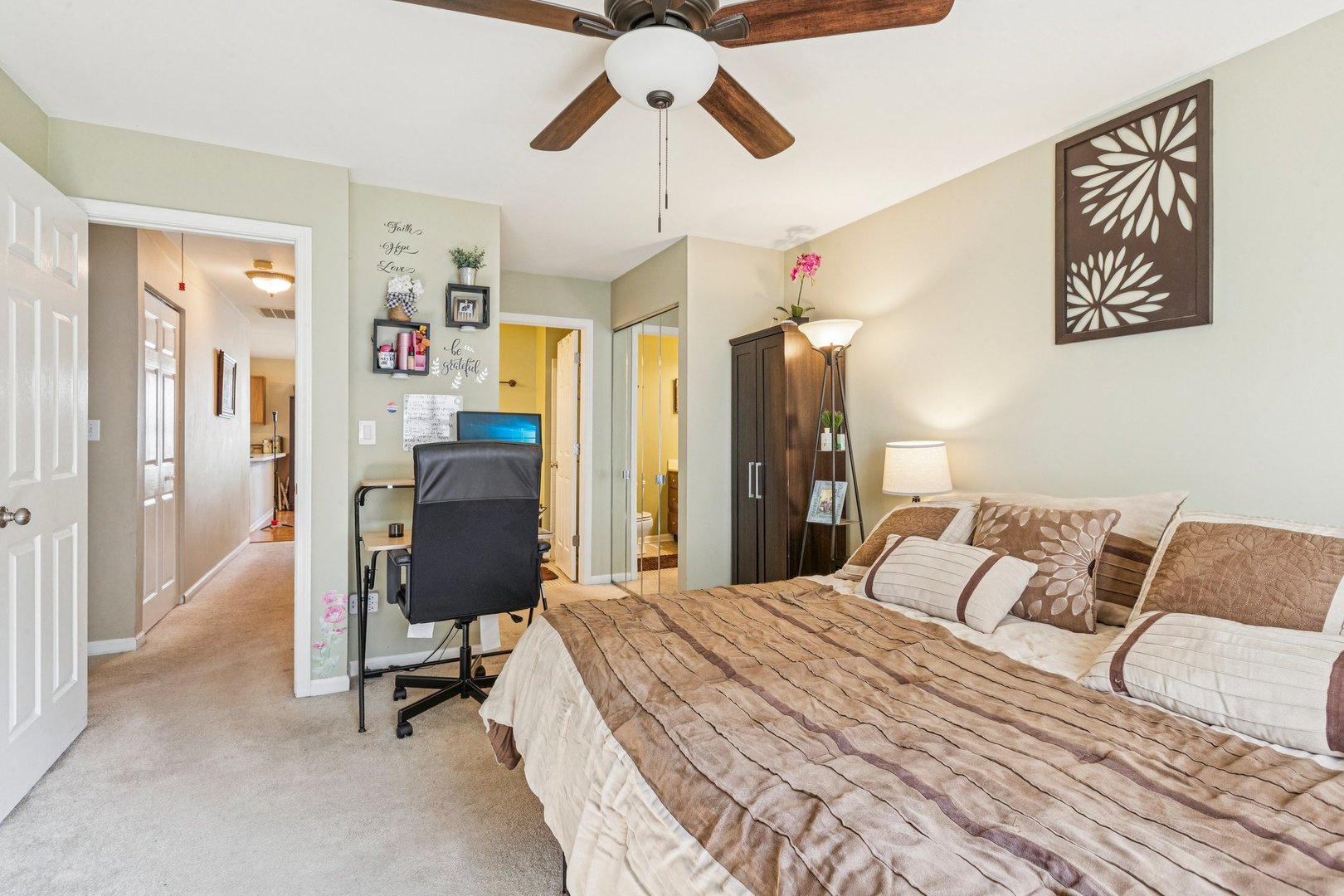 1192 Sumac Trail Hoffman Estates, IL 60192 - Photo 26 of 39 a bedroom with a bed and a chandelier