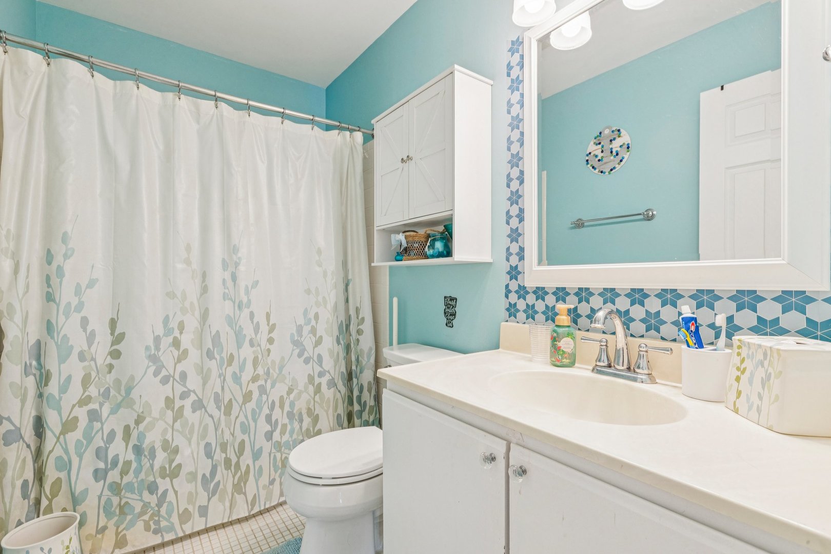1192 Sumac Trail Hoffman Estates, IL 60192 - Photo 35 of 39 a bathroom with a sink and a mirror