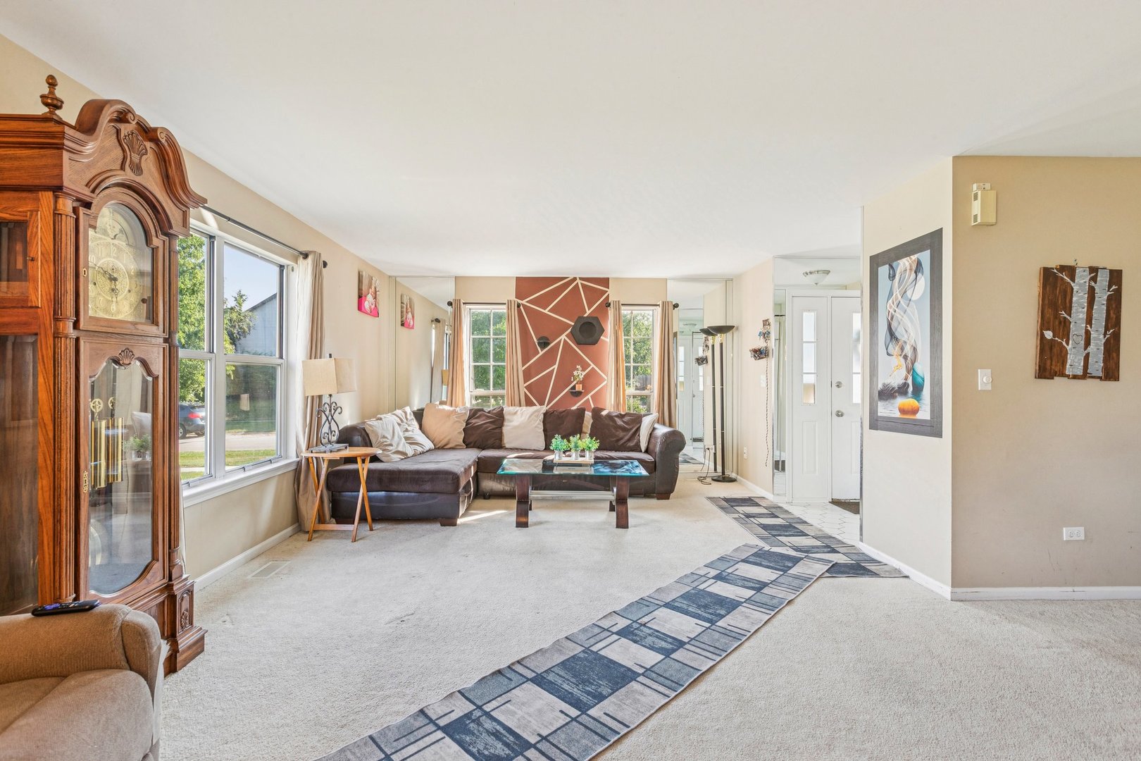 1192 Sumac Trail Hoffman Estates, IL 60192 - Photo 8 of 39 a living room with furniture and a floor to ceiling window
