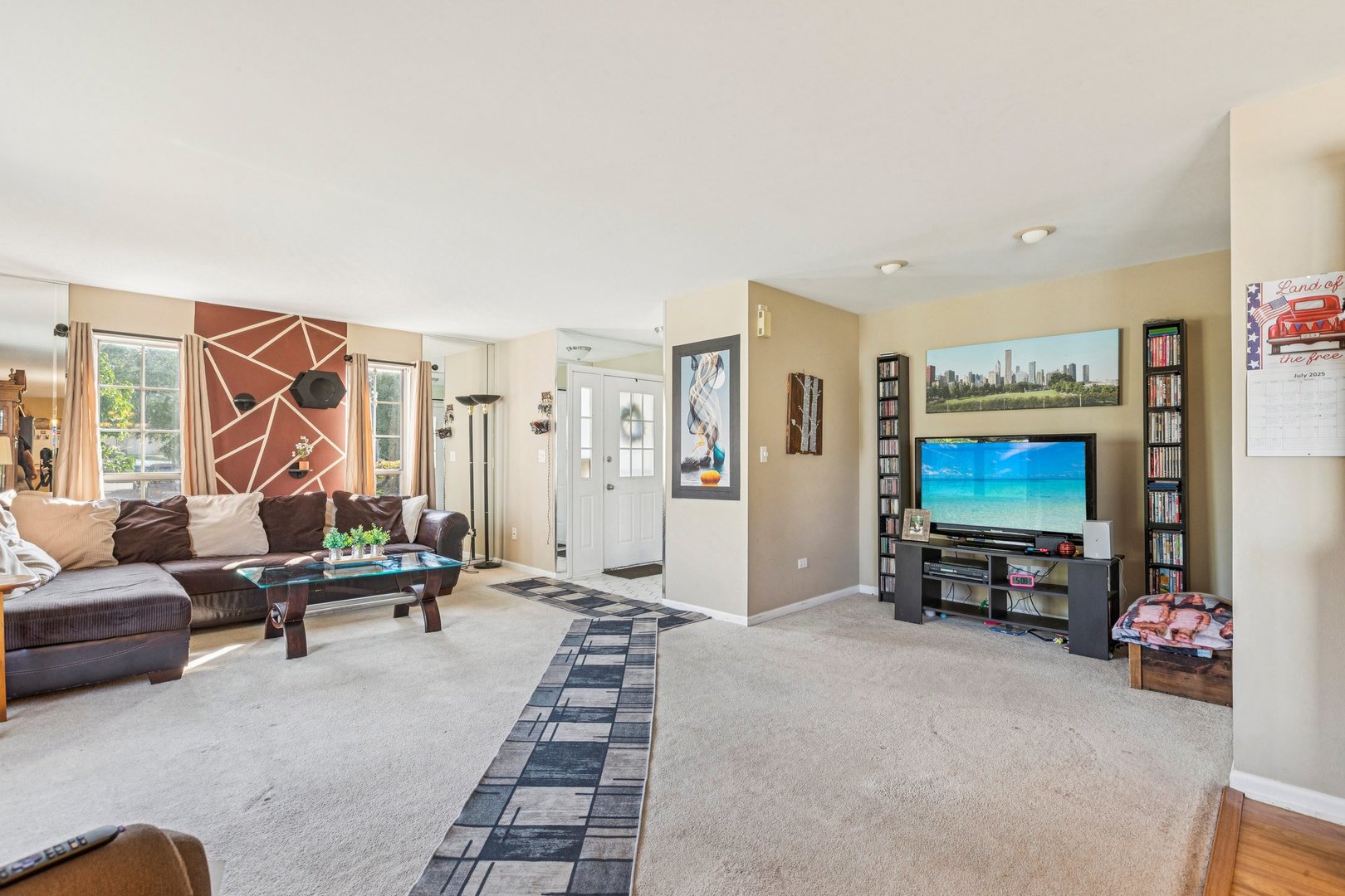 1192 Sumac Trail Hoffman Estates, IL 60192 - Photo 10 of 39 a living room with furniture and a flat screen tv