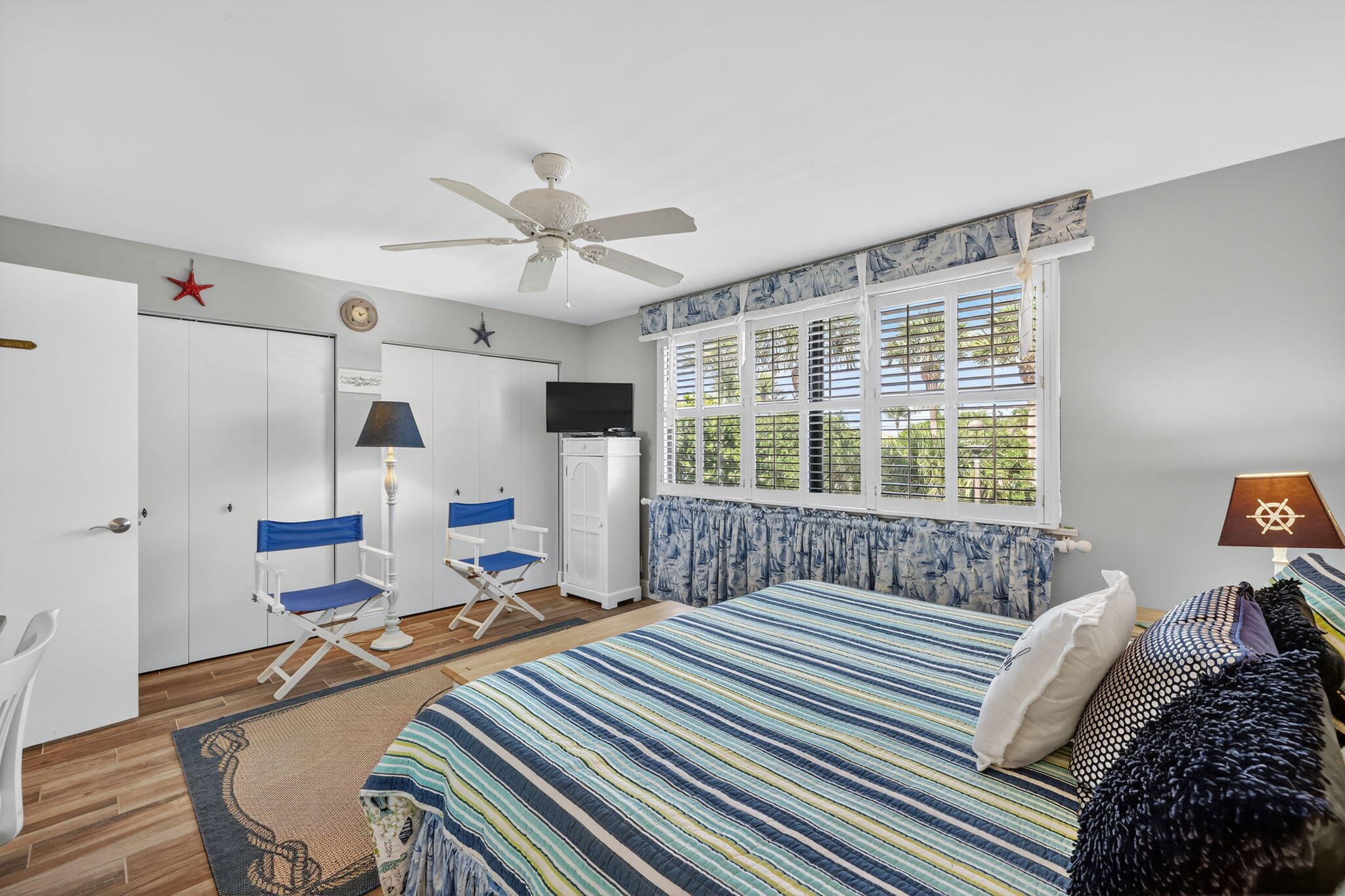 2355 Northeast Ocean Boulevard, Unit 17A Stuart, FL 34996 - Photo 16 of 30 a bedroom with a bed and a large window