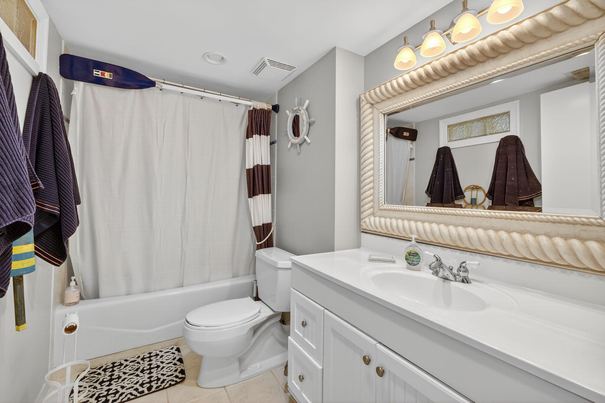 2355 Northeast Ocean Boulevard, Unit 17A Stuart, FL 34996 - Photo 18 of 30 a bathroom with a sink toilet and shower