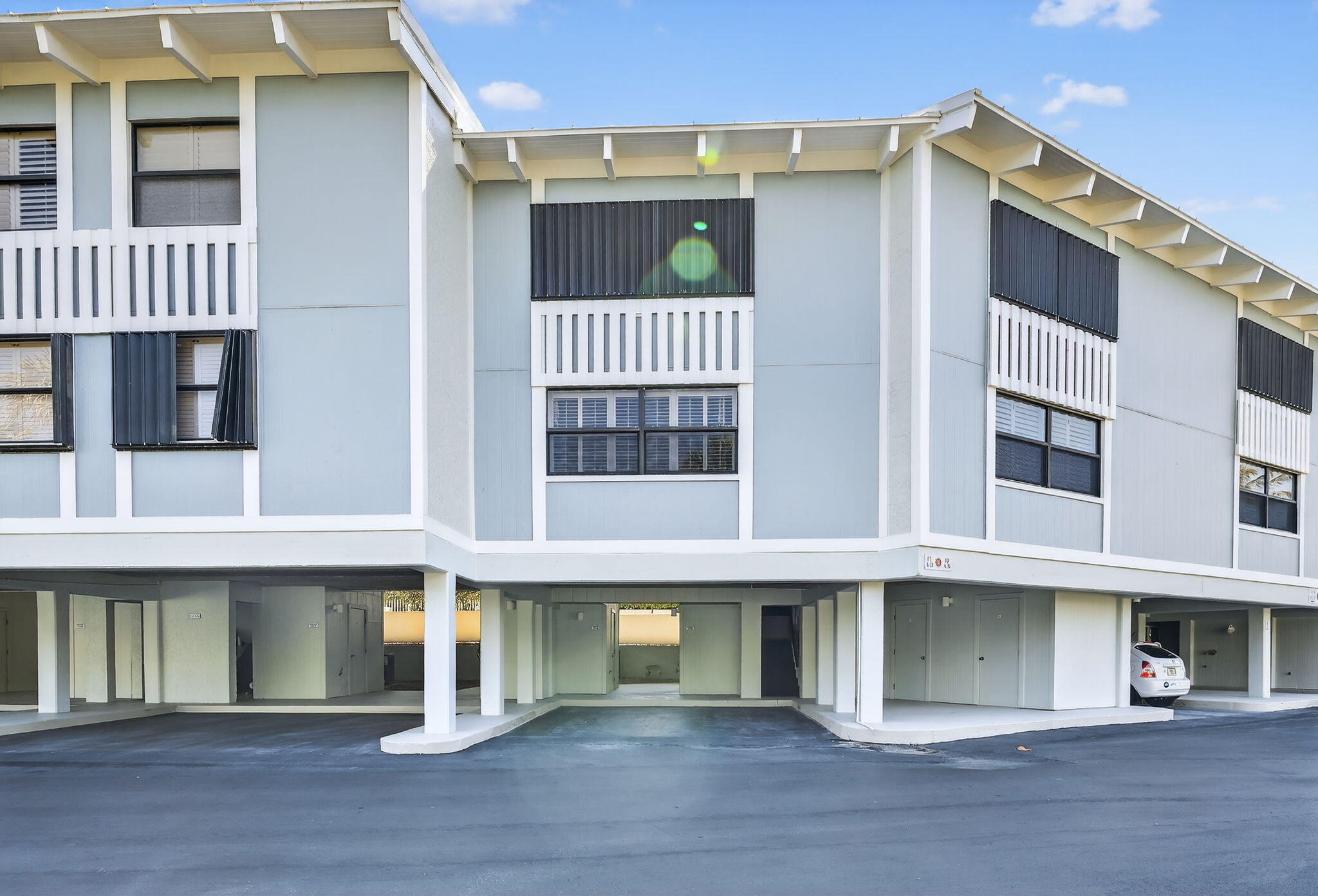 2355 Northeast Ocean Boulevard, Unit 17A Stuart, FL 34996 - Photo 19 of 30 a front view of a house with a garage