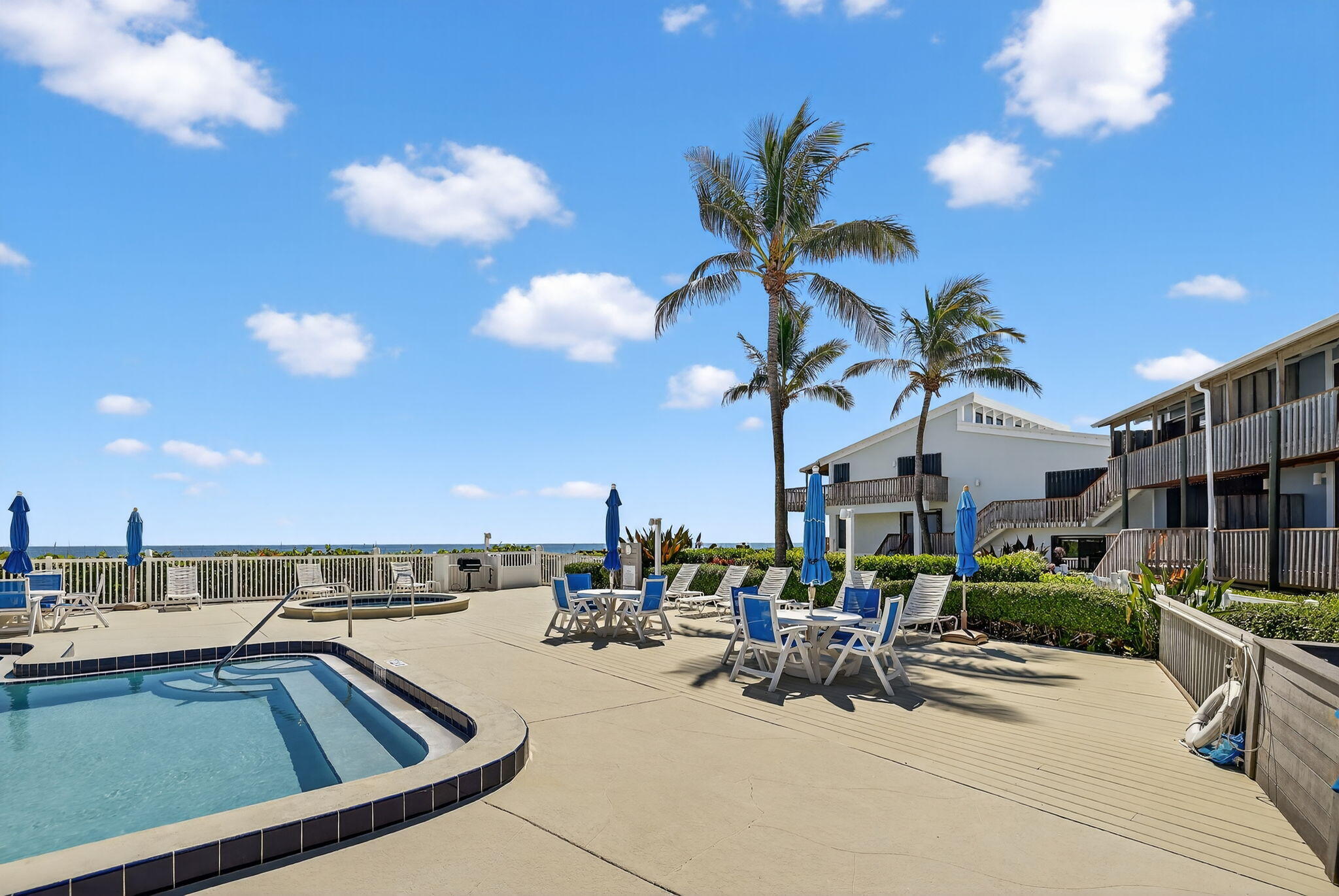 2355 Northeast Ocean Boulevard, Unit 17A Stuart, FL 34996 - Photo 24 of 30 a view of a terrace with seating area and barbeque oven