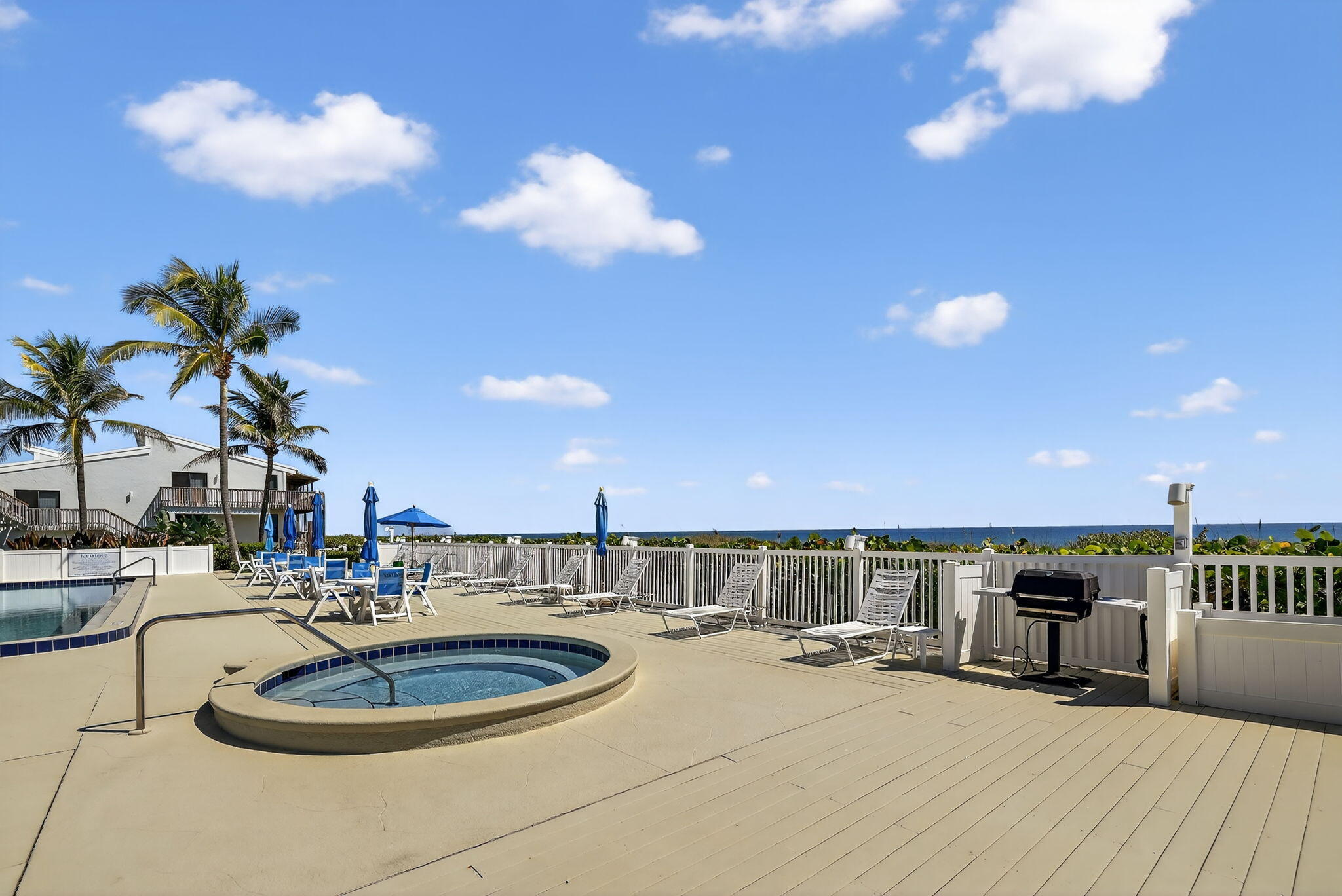 2355 Northeast Ocean Boulevard, Unit 17A Stuart, FL 34996 - Photo 26 of 30 a room with kitchen island a sink and a chandelier