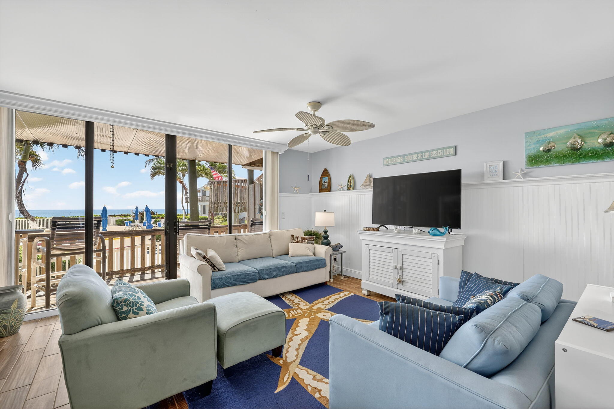 2355 Northeast Ocean Boulevard, Unit 17A Stuart, FL 34996 - Photo 3 of 30 a living room with furniture and a flat screen tv