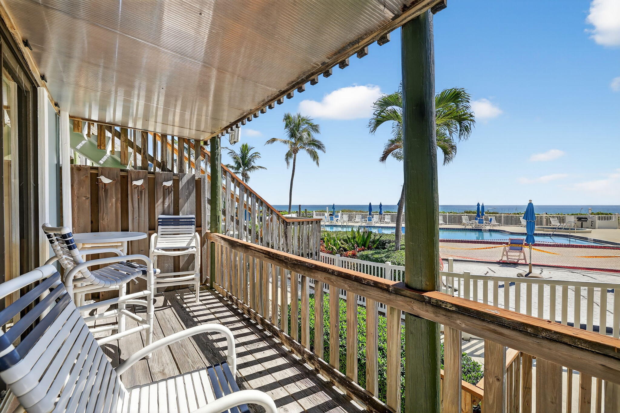2355 Northeast Ocean Boulevard, Unit 17A Stuart, FL 34996 - Photo 7 of 30 a view of a balcony with wooden floor