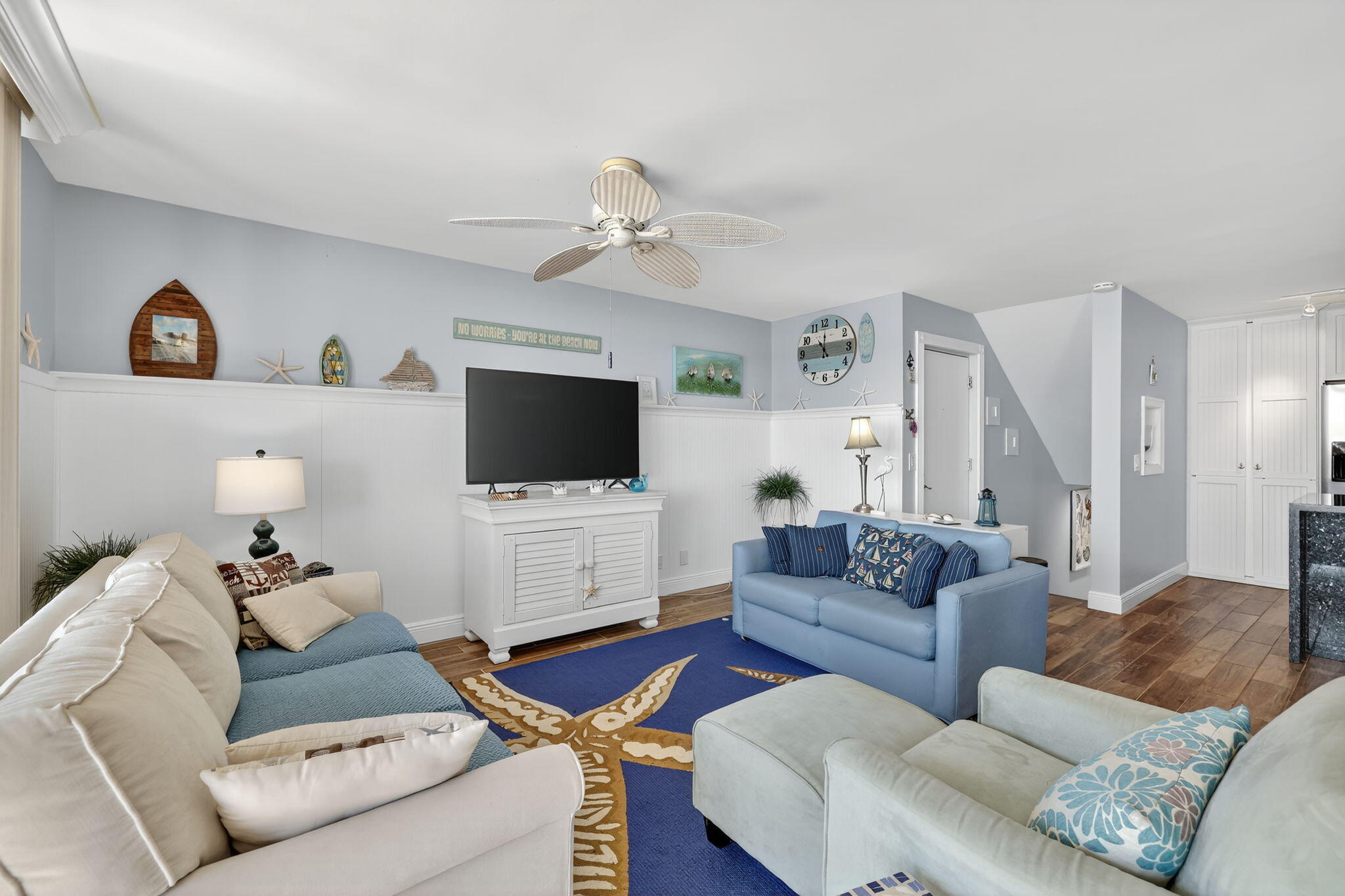 2355 Northeast Ocean Boulevard, Unit 17A Stuart, FL 34996 - Photo 8 of 30 a living room with furniture and a flat screen tv