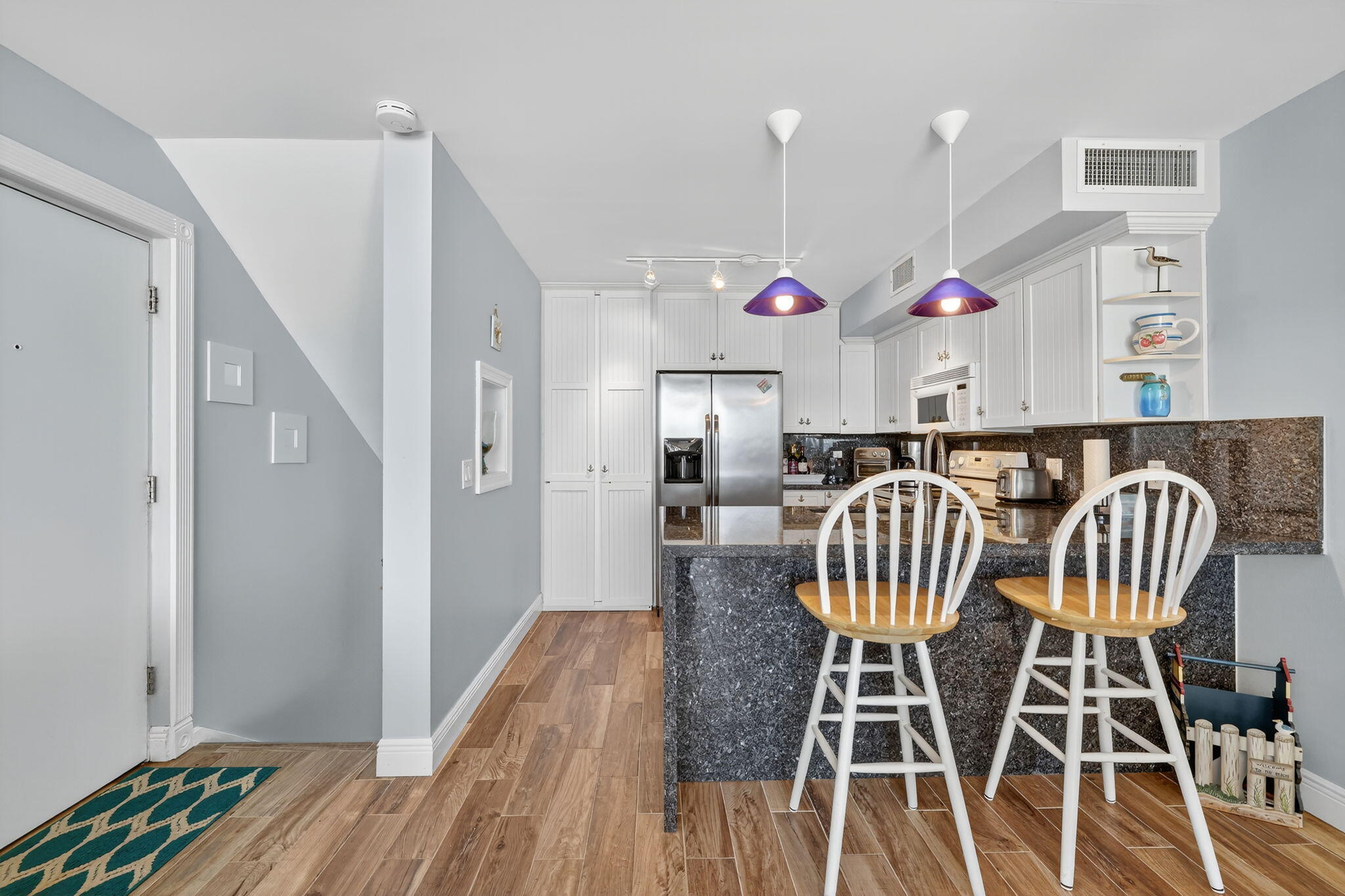 2355 Northeast Ocean Boulevard, Unit 17A Stuart, FL 34996 - Photo 10 of 30 a view of dining room and wooden floor