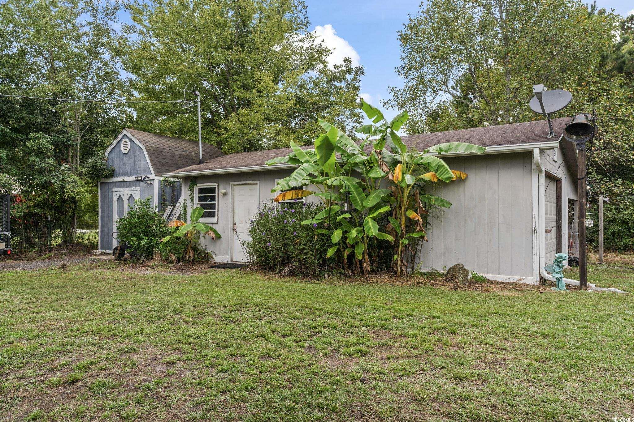 948 Heritage Road Loris, SC 29569 - Photo 17 of 21 View of yard with a storage unit