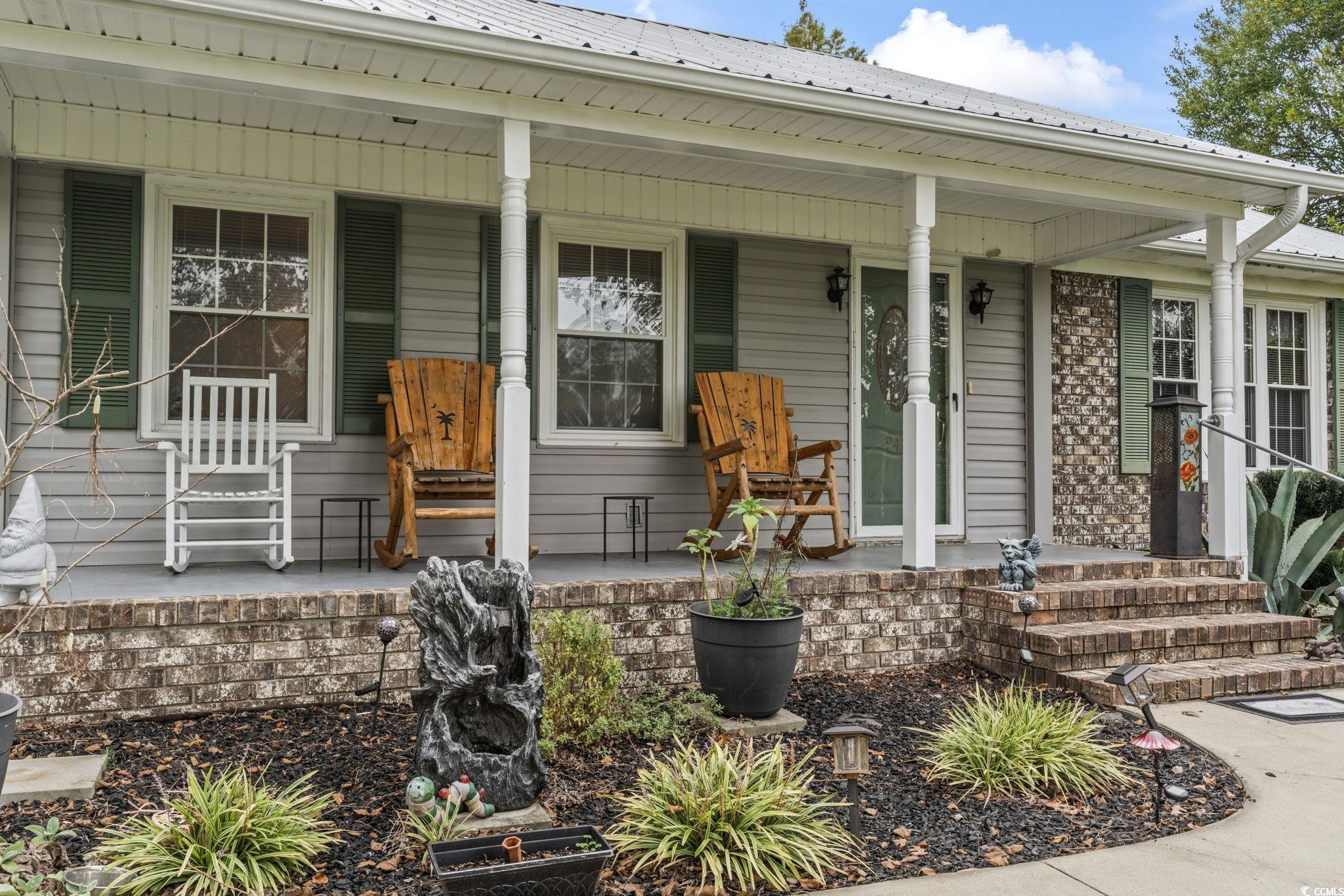 948 Heritage Road Loris, SC 29569 - Photo 3 of 21 View of front of home with a porch