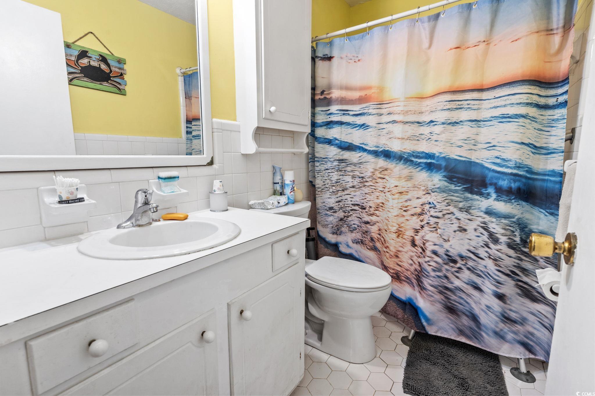 948 Heritage Road Loris, SC 29569 - Photo 10 of 21 Bathroom with tile patterned flooring, tasteful ba
