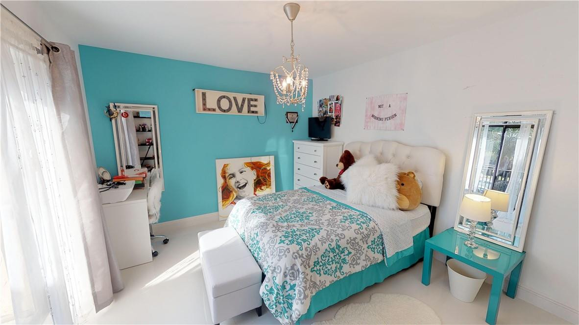 8241 Boca Rio Drive Boca Raton, FL 33433 - Photo 21 of 53 SECOND BEDROOM UPSTAIRS
