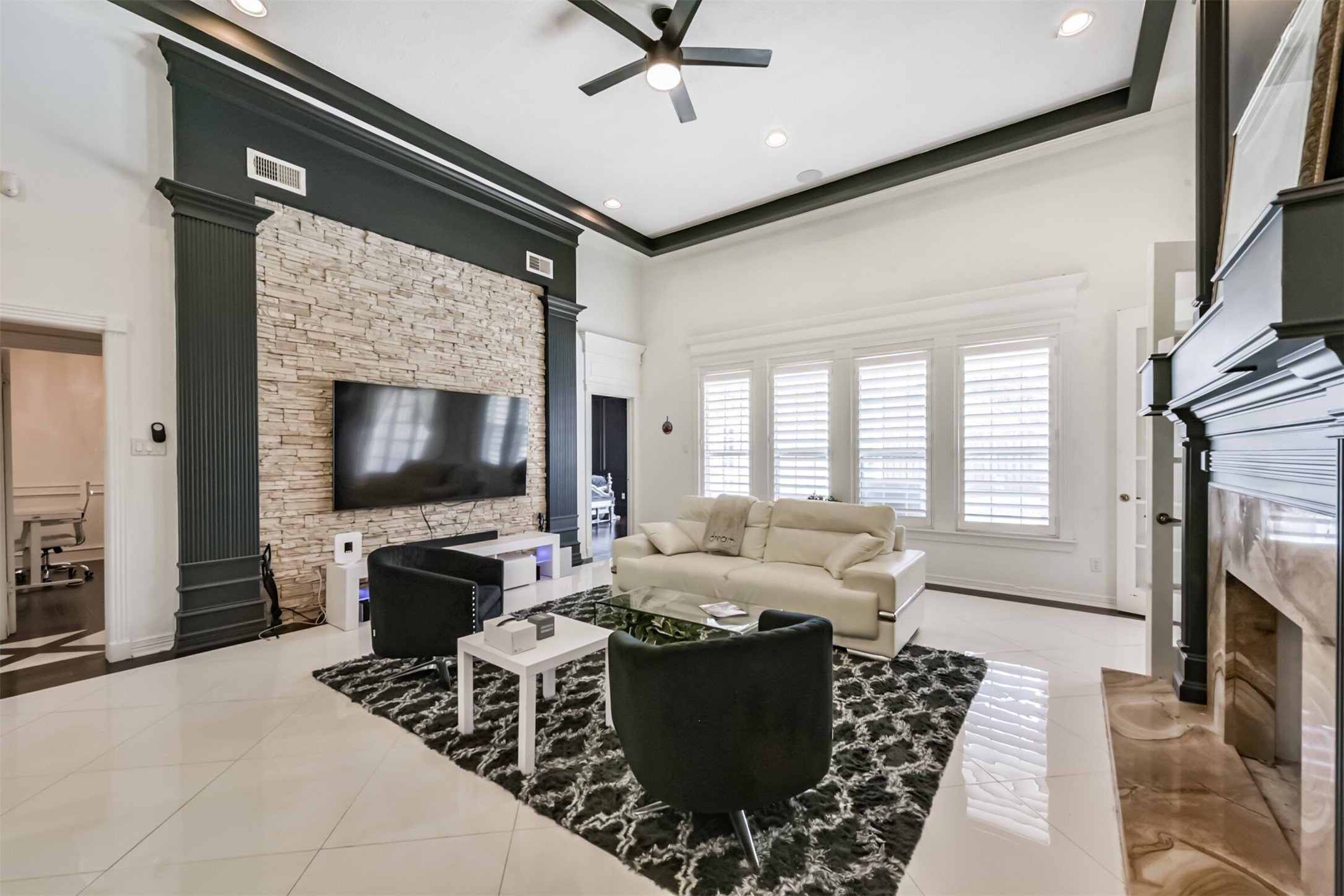 263 Wood Loop Street Houston, TX 77015 - Photo 11 of 48 a living room with furniture a flat screen tv and a fireplace