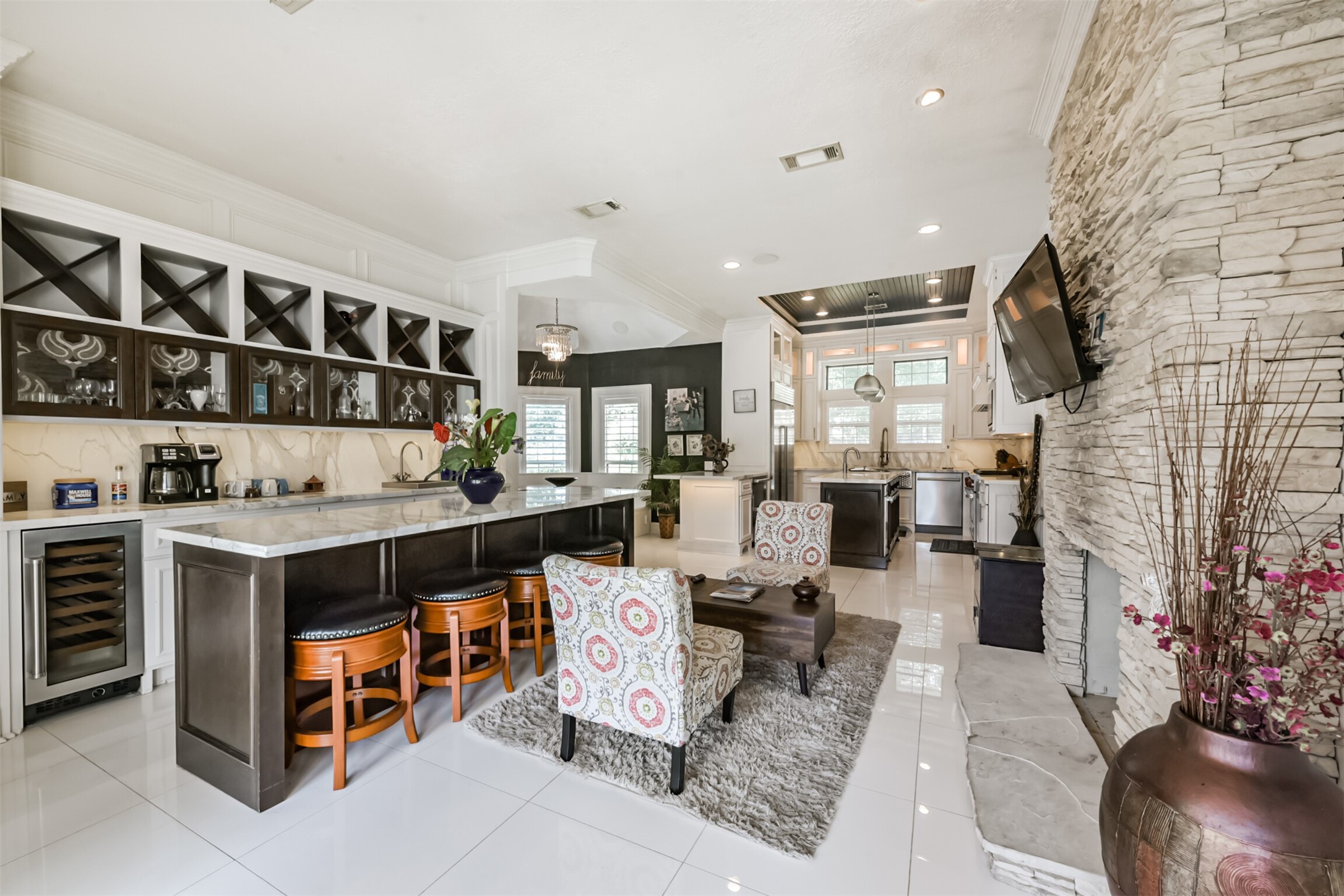 263 Wood Loop Street Houston, TX 77015 - Photo 15 of 48 a living room with stainless steel appliances kitchen island granite countertop a table and chairs in it