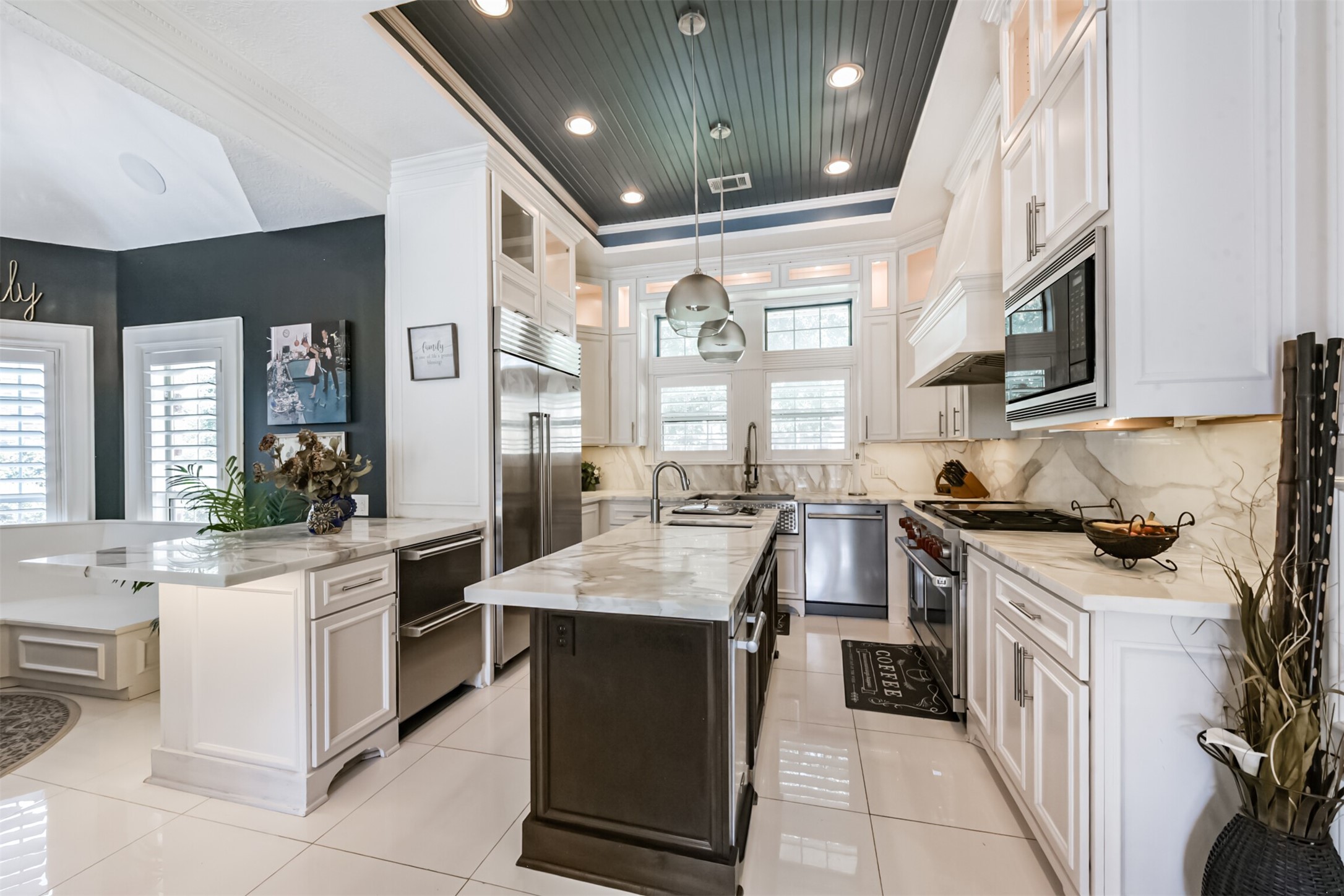 263 Wood Loop Street Houston, TX 77015 - Photo 17 of 48 a kitchen with a stove top oven sink and cabinets