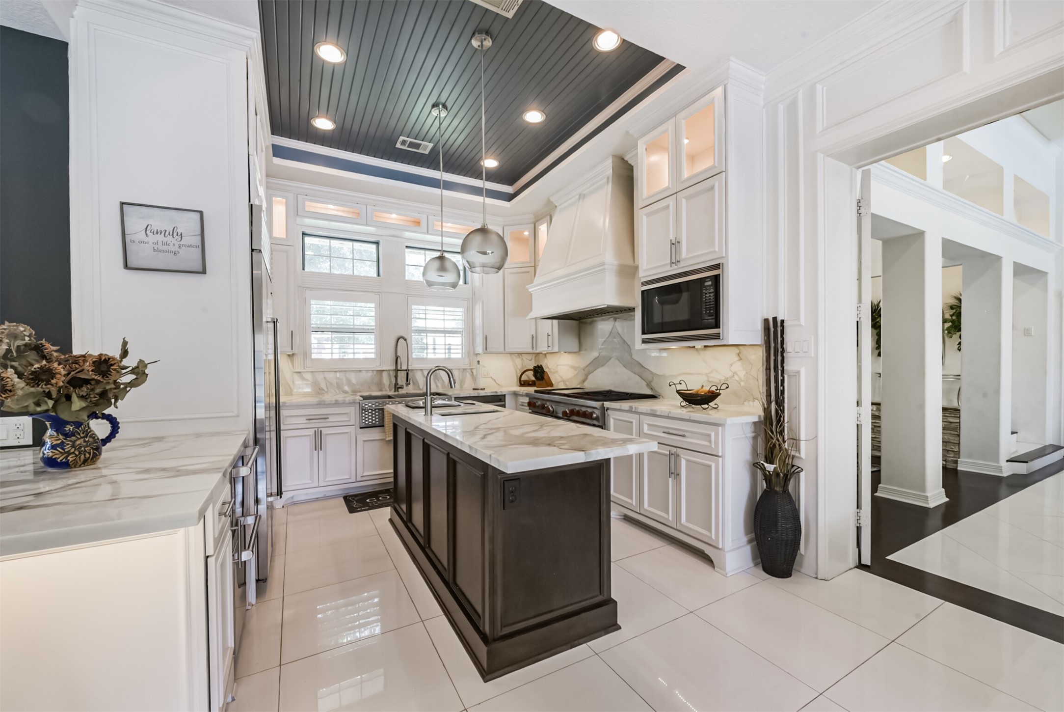 263 Wood Loop Street Houston, TX 77015 - Photo 19 of 48 a kitchen with stainless steel appliances granite countertop a stove and a sink