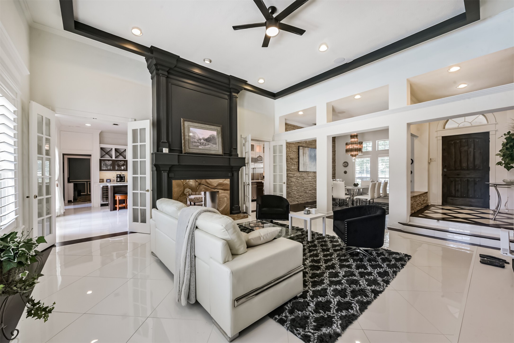 263 Wood Loop Street Houston, TX 77015 - Photo 3 of 48 a living room with furniture a fireplace and a flat screen tv