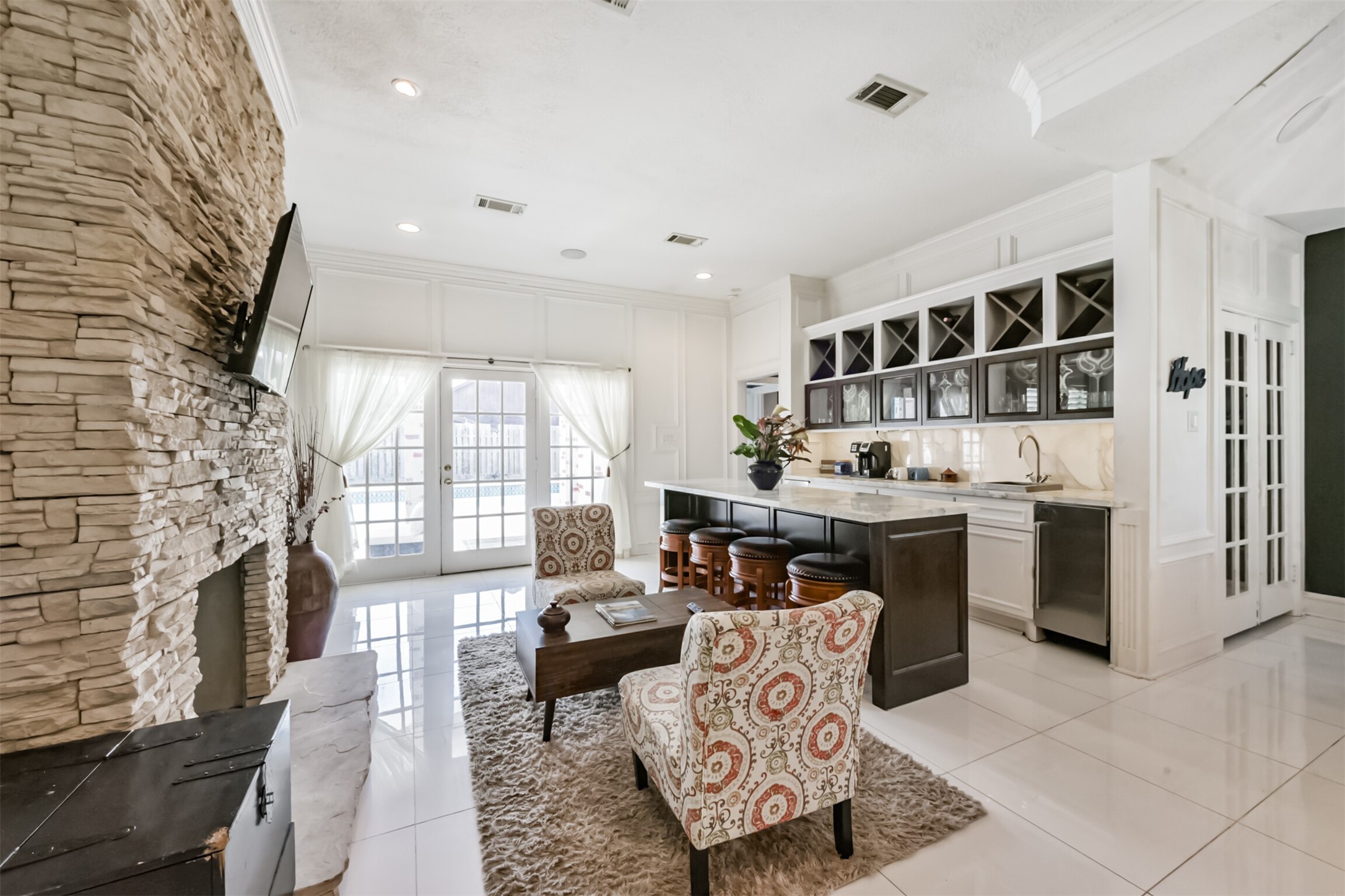 263 Wood Loop Street Houston, TX 77015 - Photo 5 of 48 a living room with furniture a rug kitchen view and a large window
