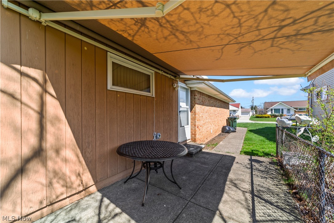1730 Alcester Road Mayfield Heights, OH 44124 - Photo 28 of 39 Side patio featuring a high end retractable awning